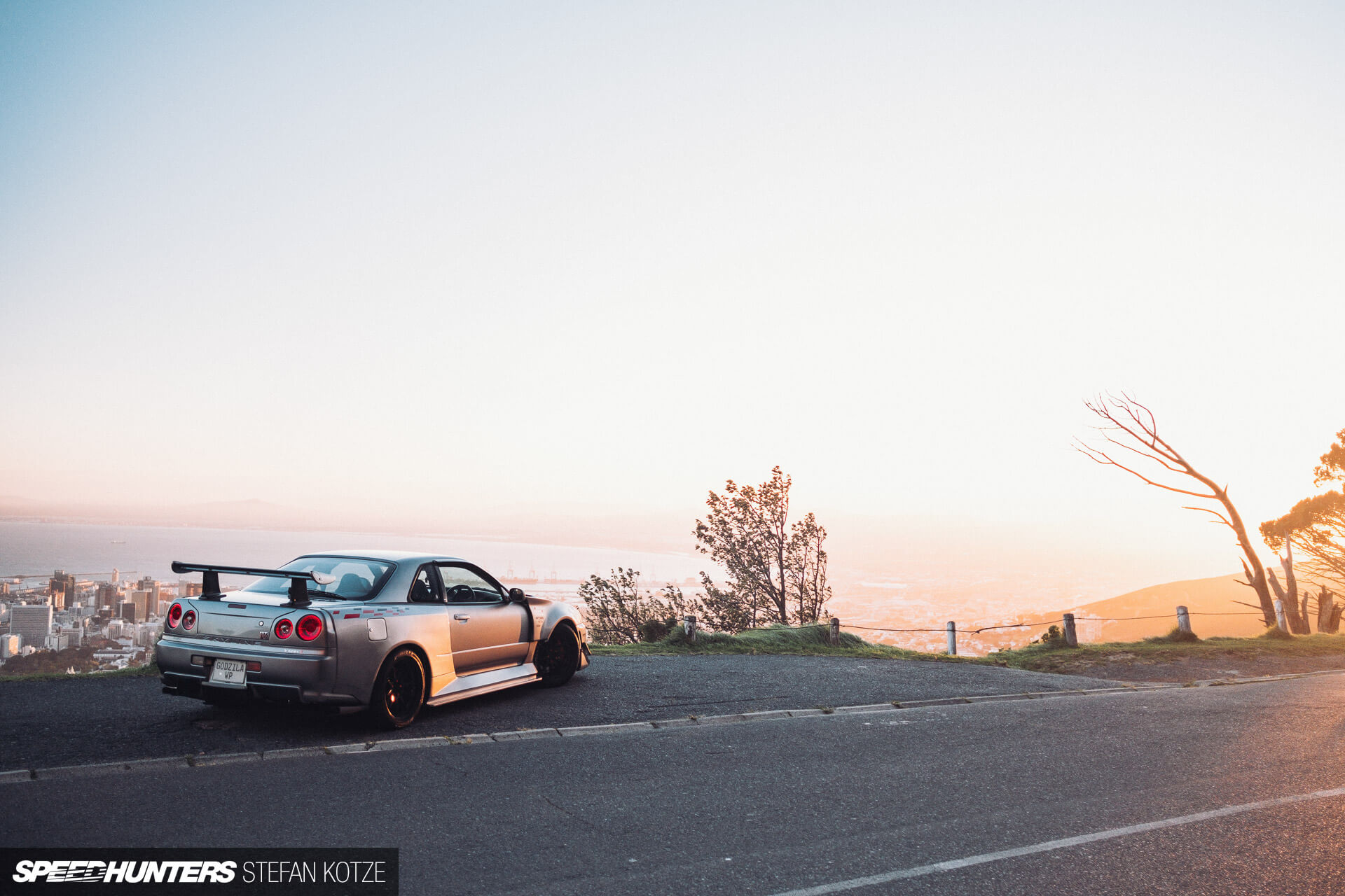 Nissan Skyline R34 GT-R with a sky background