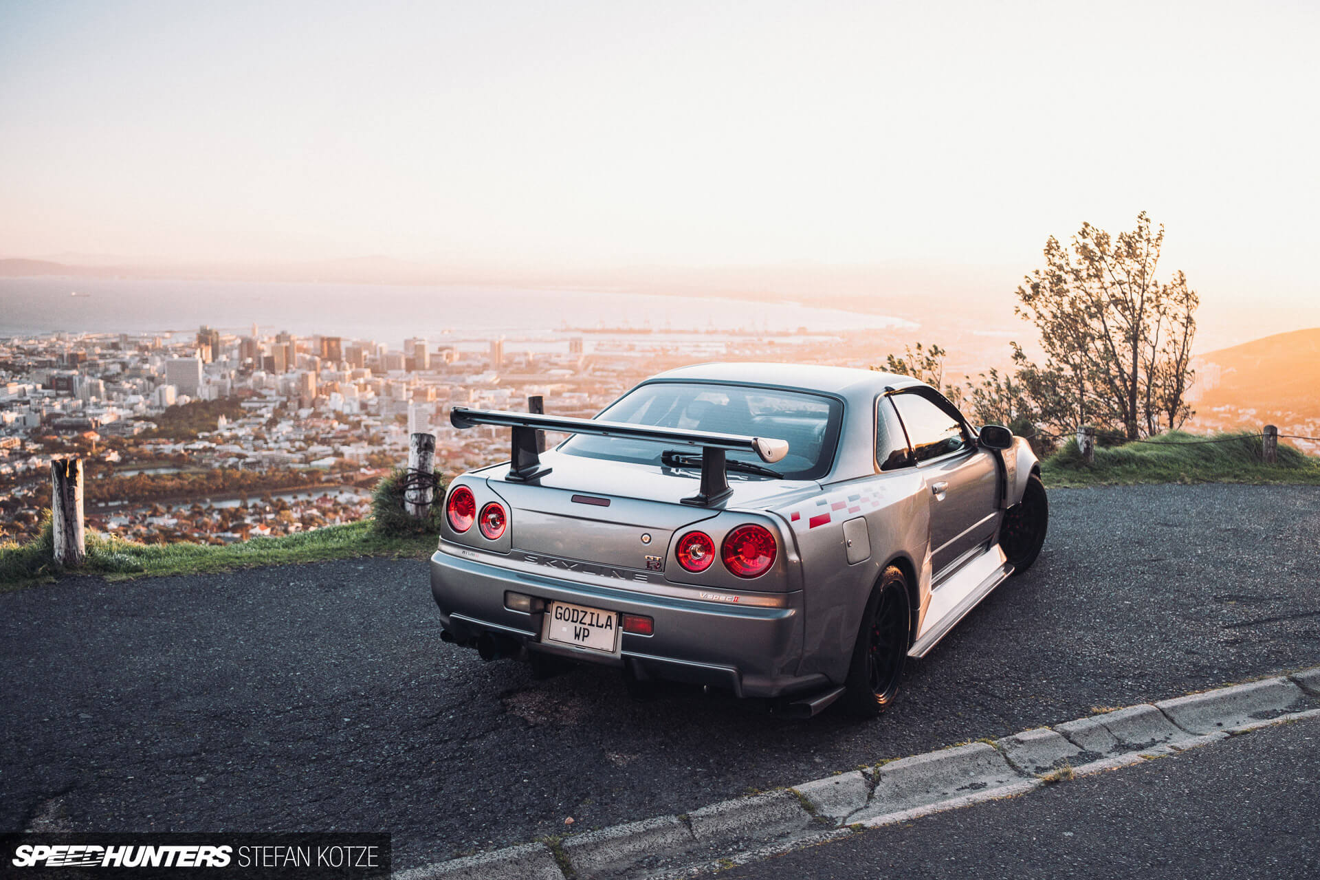 Nissan Skyline R34 GT-R with a sky background