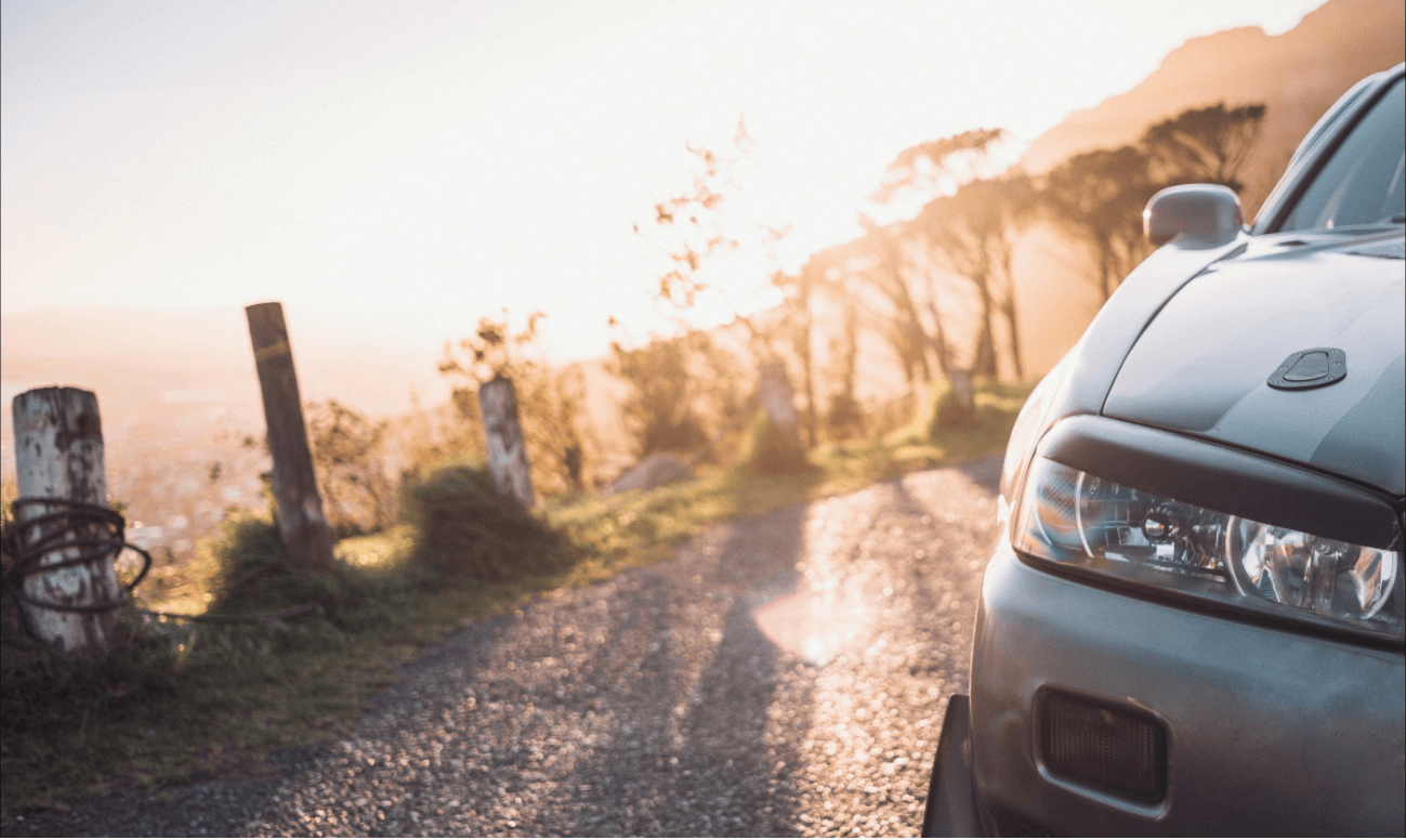 Right front of Nissan Skyline R34 GT-R 
                    with a sunshine background